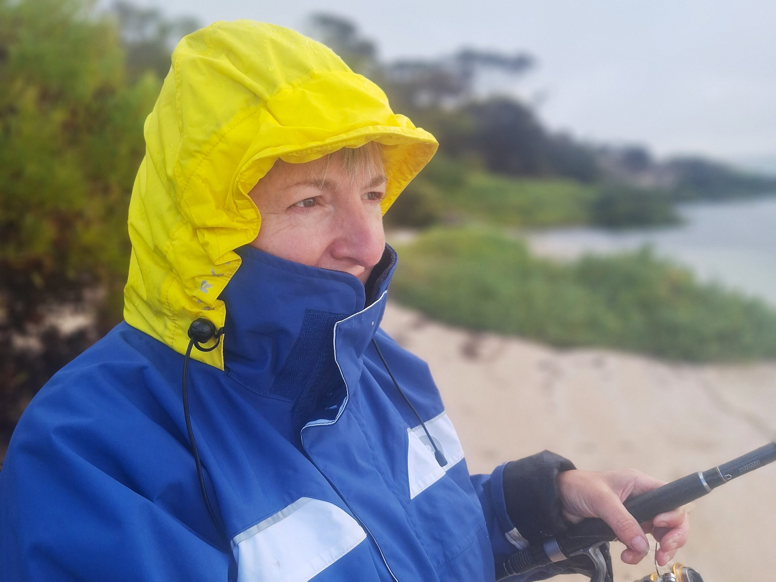 Picture of fishing sister in wet weather gear